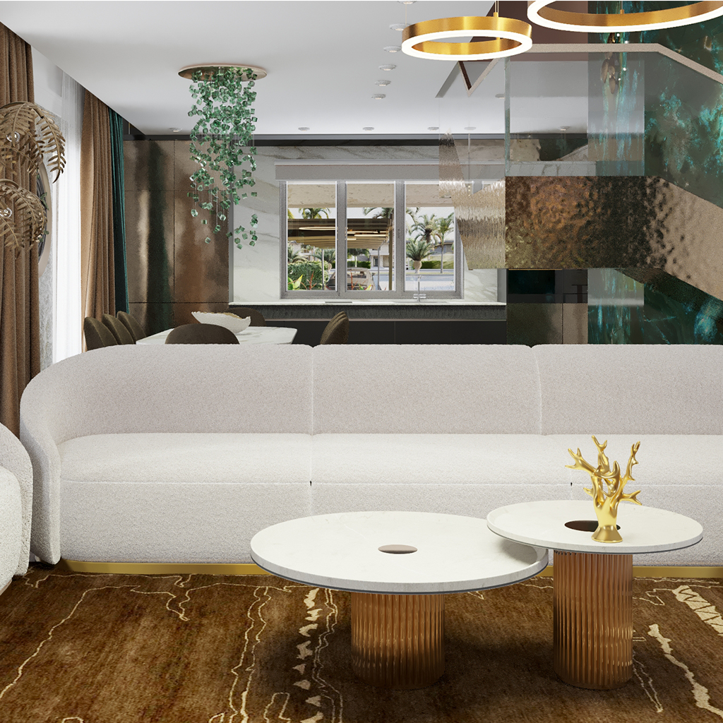 Вид на диван, за которым видно лестницу на второй этаж и кухню-столовую